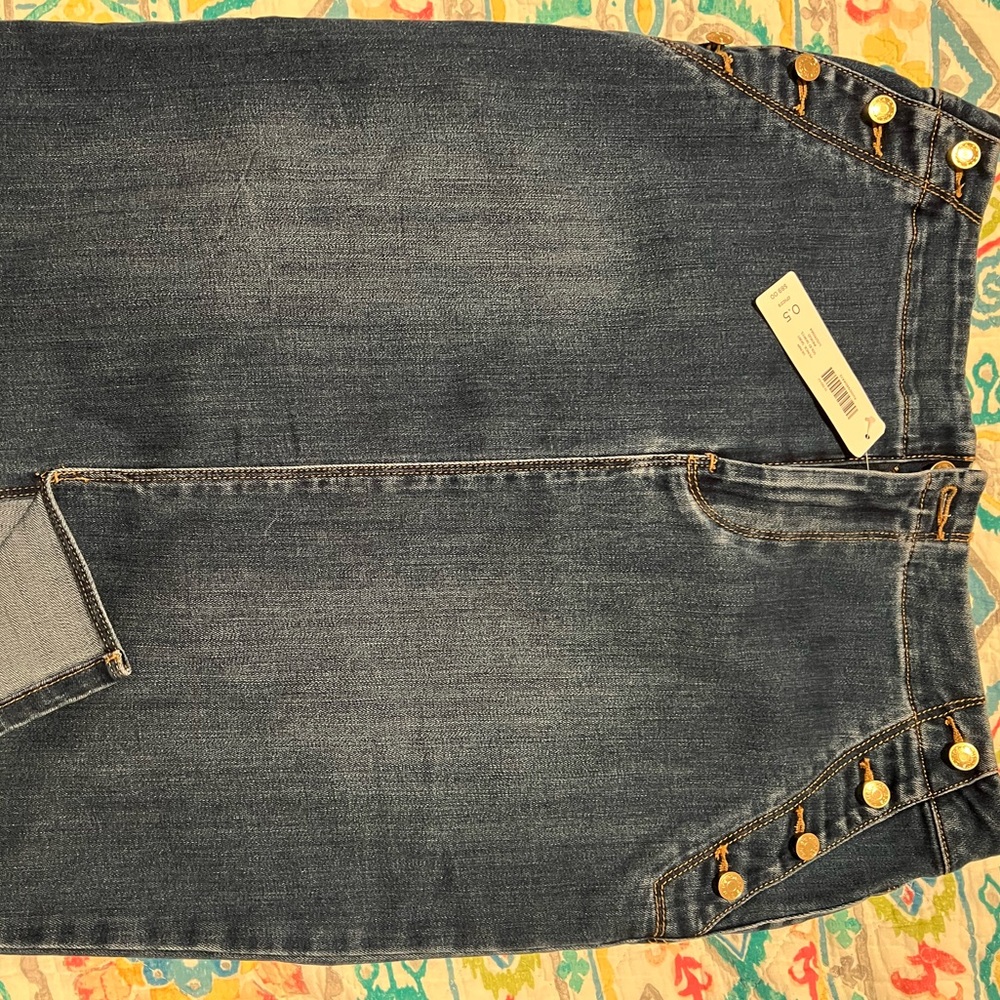 Chico denim skirt. NWT cute button pockets! Never worn. Just above knee length.